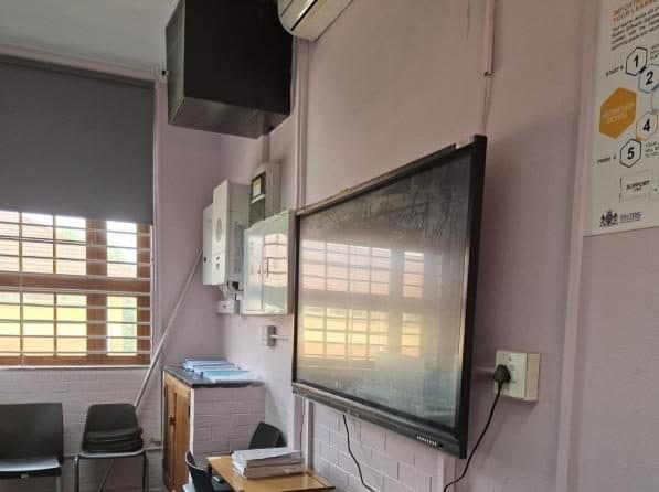 An interactive smartboard installed in a classroom.