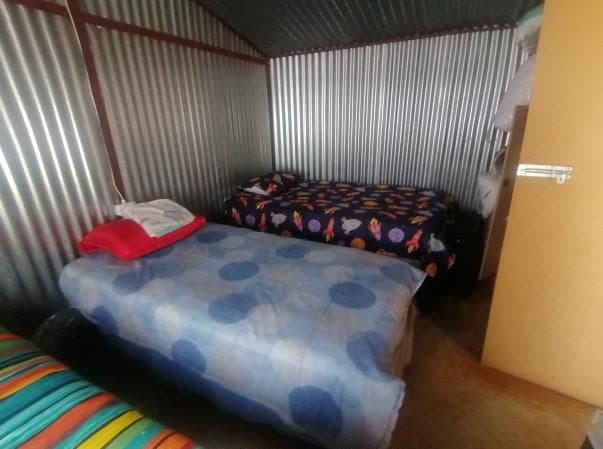 A furnished room inside a gender-based violence support centre.