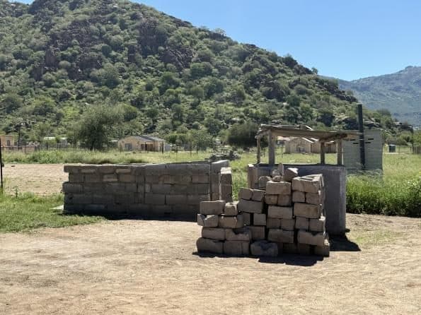 A sanitation block under construction in a rural settlement.